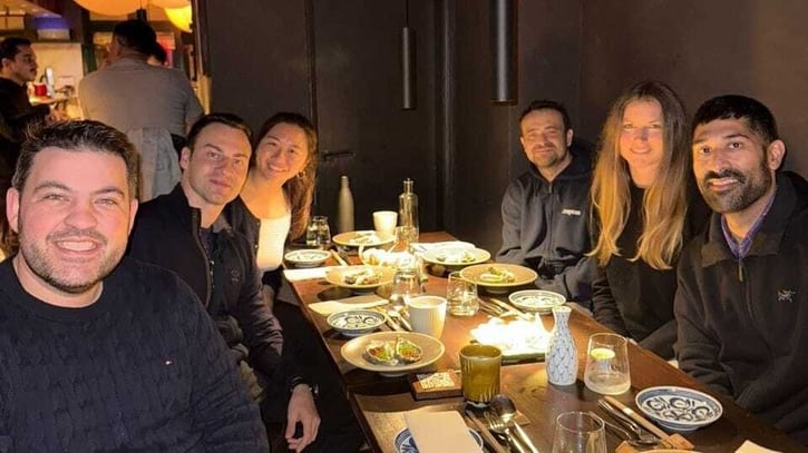 Here's Dennis (second from the left) at a Hampton dinner.