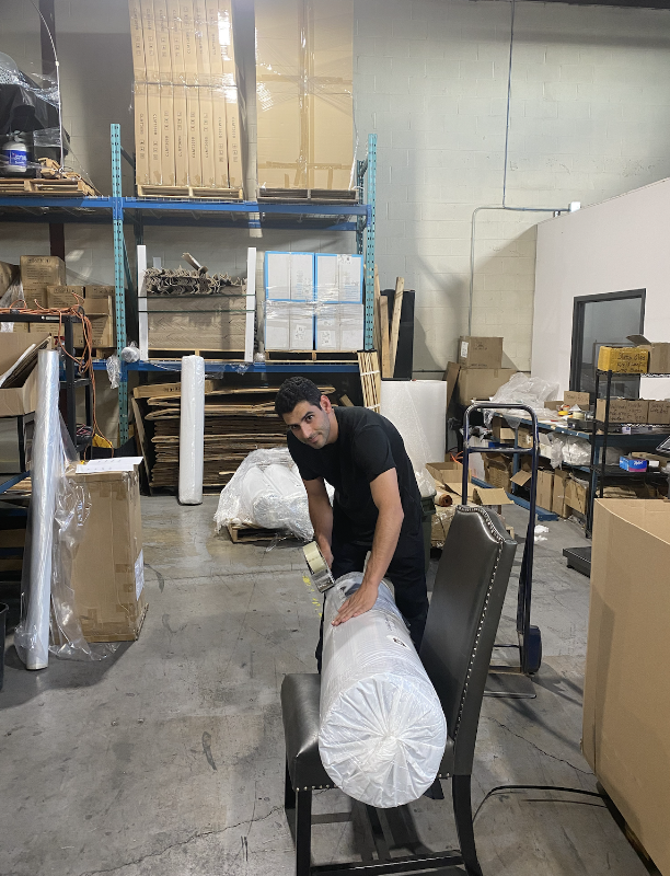 My business partner packing textiles for our first project