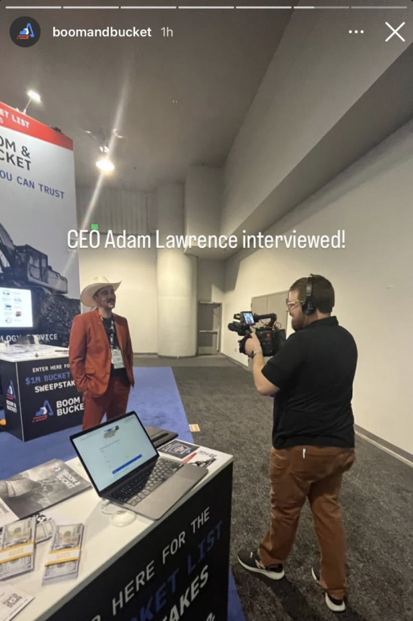 Adam being interviewed at a field event