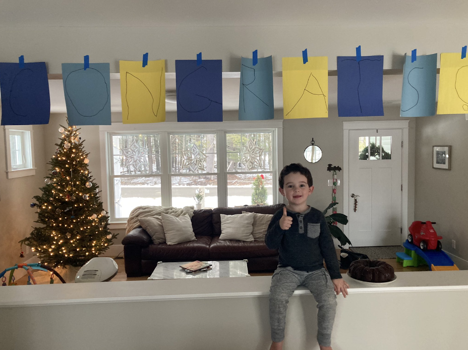 My oldest with a cake and congrats sign after closing